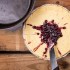 Cutting, serving, and clean up of Dutch oven cheese cake becomes amazingly easy when you use a pie tin inside the Dutch oven.