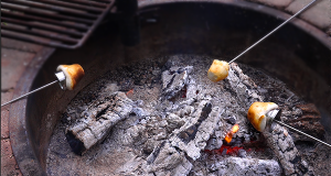 Roast campfire biscuit cups on a variety of types of sticks.
