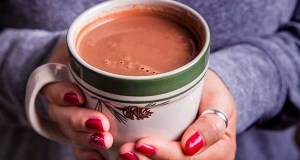 Warming hands on mug of Red Wine Hot Chocolate - The Perfect Camping Cocoa, made with Black Box Cabernet Sauvignon.