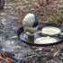 Mesquite pancakes cooking over open campfire.