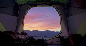 Desert sunsets viewed through the tent fly are worth putting up with the sand, searching for water, and avoiding scorpions.