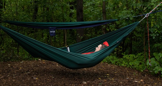 person laying in a hammock